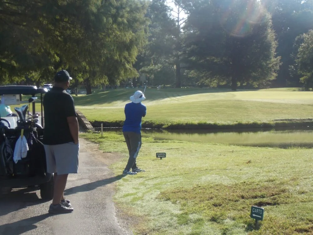 Golfer participating in a COMEC charity golf tournament